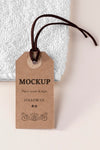 Clothing Mock-Up Tag And White Towel Psd