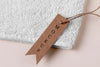 Clothing Mock-Up Tag And White Towel Psd