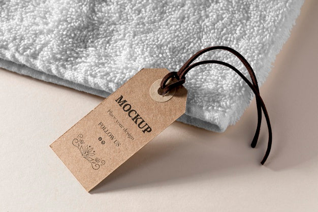 Clothing Mock-Up Tag With Thread On Towel Psd