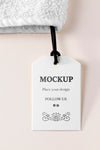 Clothing Mock-Up Tag With Thread On Towel Psd