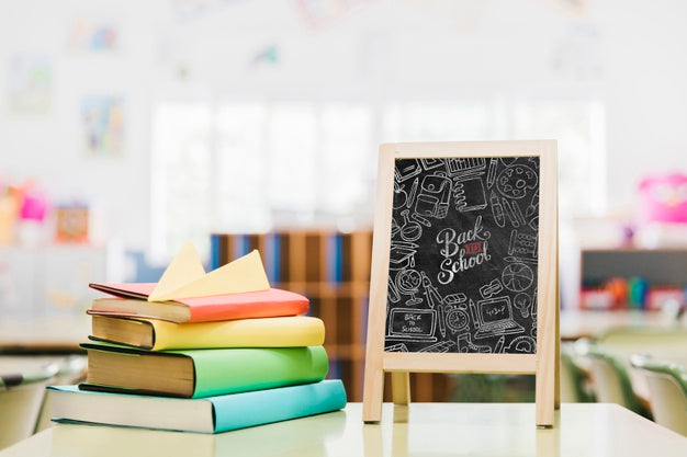 Colorful Books Next To School Blackboard Mock-Up Psd