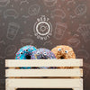 Colorful Donuts In Wooden Crate With Mock-Up Psd
