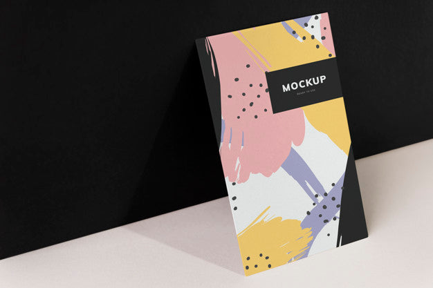 Colorful Paperboard Mockup Against The Black Wall Psd