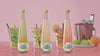Colourful Soda Bottles With Pink Background Psd
