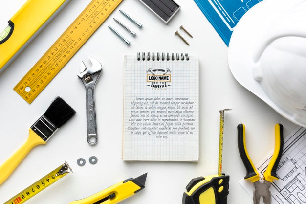 Composition Of Different Repairing Tools With Notepad Mock-Up Psd