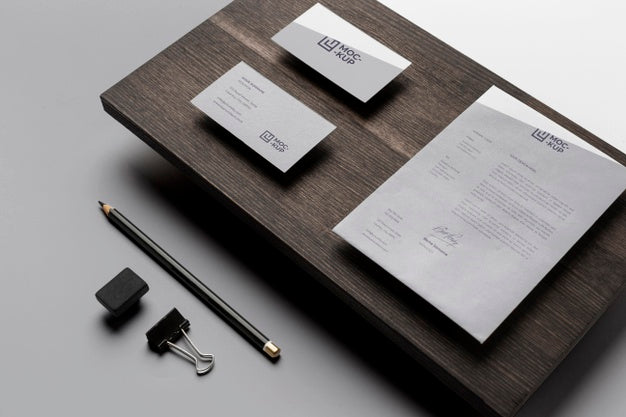 Composition Of Mock-Up Stationery On Wood Psd