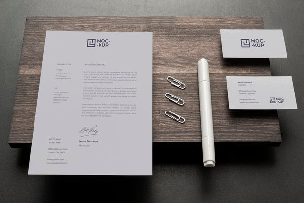 Composition Of Mock-Up Stationery On Wood Psd