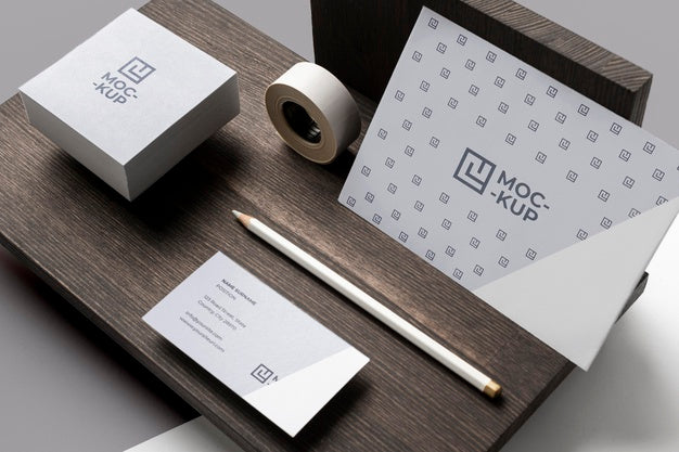 Composition Of Mock-Up Stationery On Wood Psd