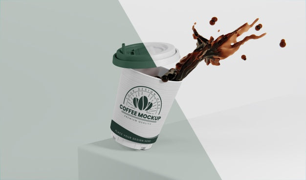 Composition Of Paper Coffee Cup With Coffee Splash Psd