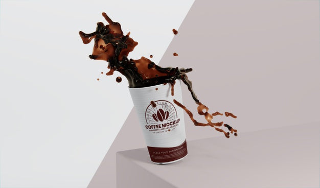 Composition Of Paper Coffee Cup With Coffee Splash Psd