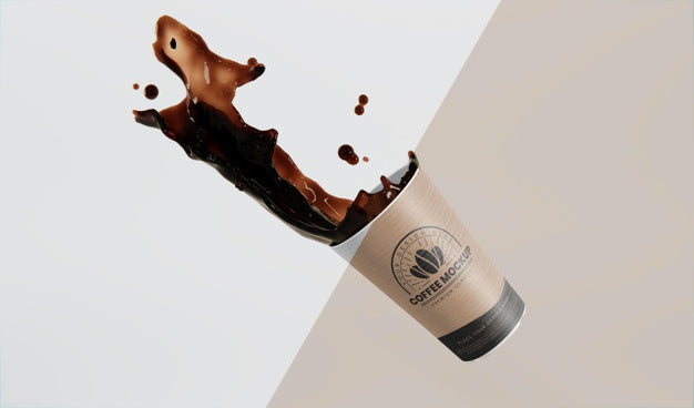 Composition Of Paper Coffee Cup With Coffee Splash Psd