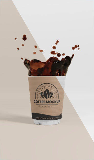 Composition Of Paper Coffee Cup With Coffee Splash Psd
