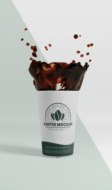 Composition Of Paper Coffee Cup With Coffee Splash Psd