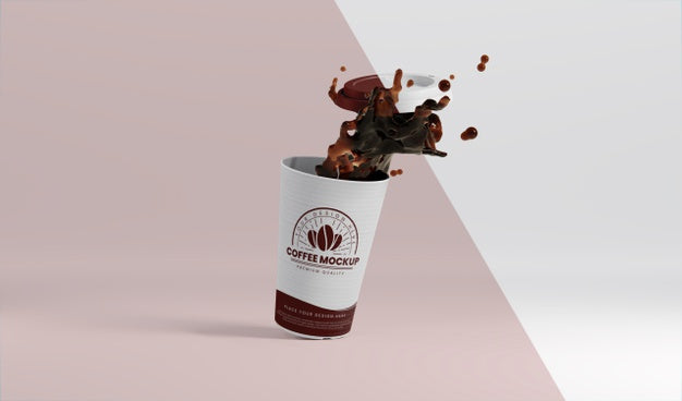 Composition Of Paper Coffee Cup With Coffee Splash Psd
