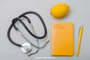 Composition With Notebook, Stethoscope And Lemmon Psd