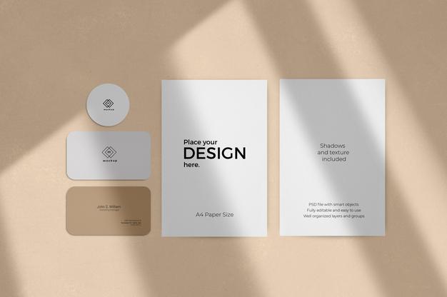 Corporate Stationary Set Mockup With Window Shadow Effect On A Beige Wall Psd