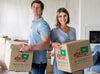 Couple Holding Boxes For Their New Home And Being Happy Psd