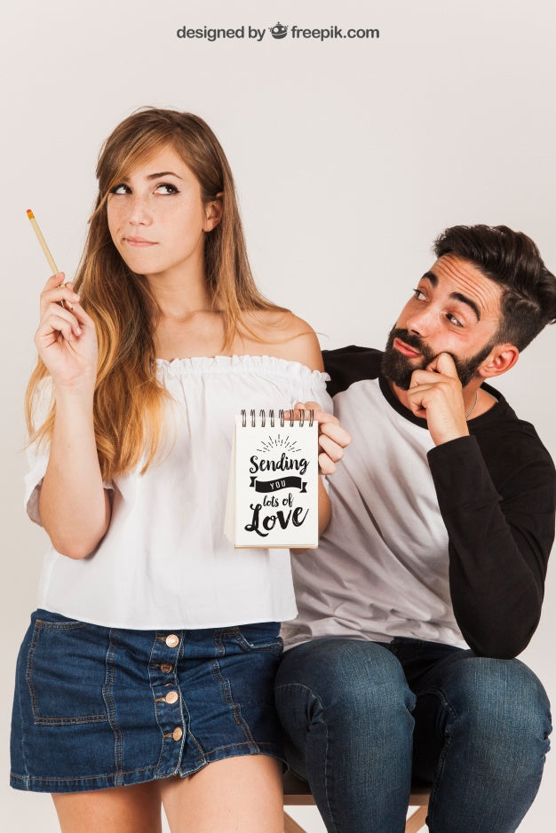 Couple Holding Notepad Psd