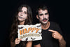 Couple Holding Paper With Halloween Lettering Psd