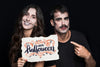 Couple Holding Paper With Halloween Lettering Psd