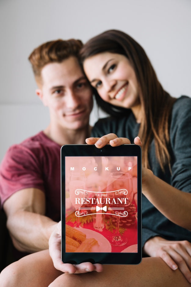 Couple Holding Tablet Mockup For Valentine Psd