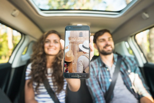 Couple In Car Showing Smartphone Mockup Psd
