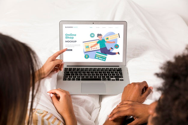 Couple Looking At A Landing Page Psd