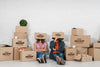 Couple Posing Silly With Moving Boxes Over Their Heads Psd