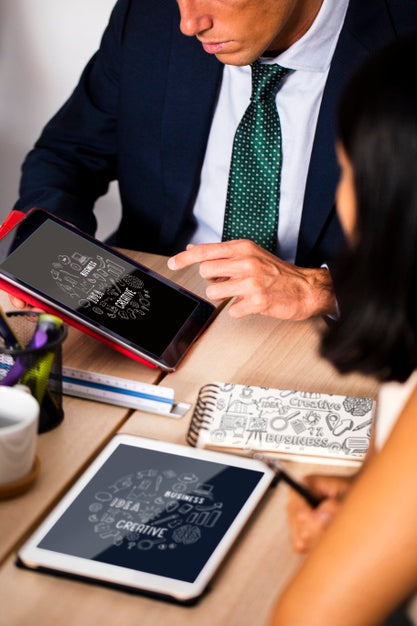Coworkers In A Meeting Using Tablet Psd