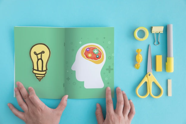 Creativity Concept With Open Brochure Psd