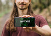 Cute Man In Nature With Smartphone Mock-Up Psd