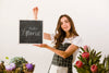 Cute Young Woman Holding Mock-Up Sign Psd