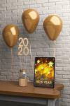 Decorations On Table Beside Tablet With Message For New Year Psd