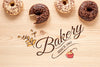 Delicious Donuts On Wooden Table Mock-Up Psd
