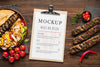 Delicious Meat Skewers Mock-Up With Restaurant Menu Psd