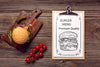 Delicious Tomatoes And Burger On Wooden Background Psd