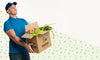 Delivery Man Holding A Box With Different Vegetables With Copy Space Psd