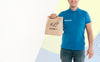 Delivery Man Holding A Shopping Bag With Copy Space Psd