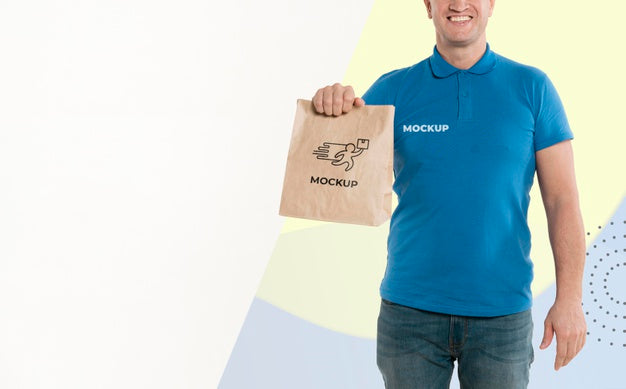 https://mockuphunt.co/cdn/shop/products/delivery-man-holding-a-shopping-bag-with-copy-space-psd_6077f0afa0e9e_800x.jpg?v=1647877876