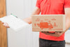 Delivery Mockup With Man Holding Box And Clipboard Psd