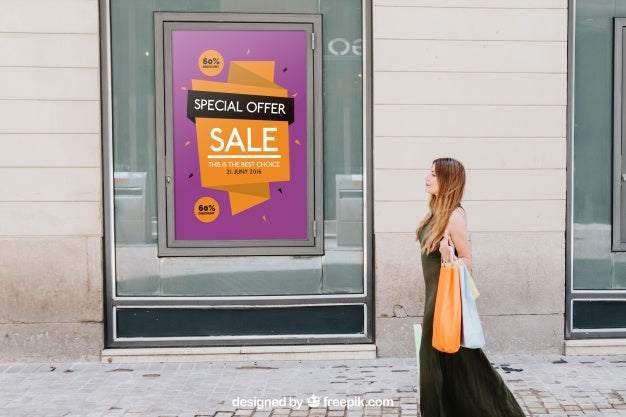 Design Of Mock Up With Sales Poster And Woman In The Street Psd