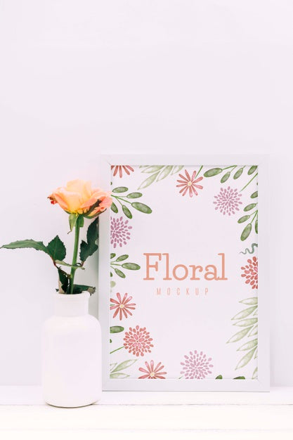 Desk Composition With Flower Decor And Frame Mockup Psd