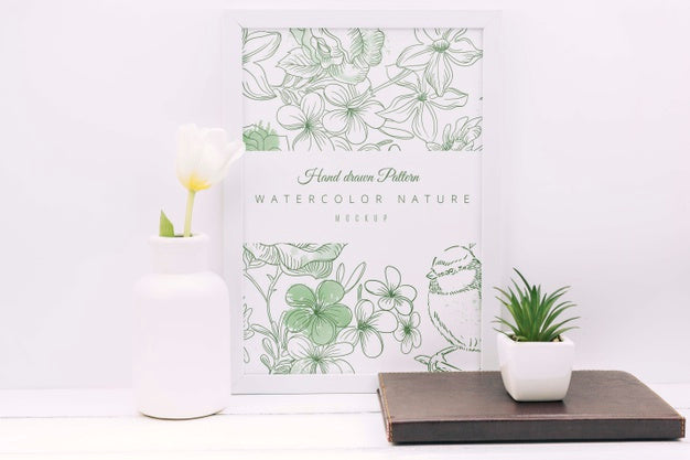 Desk Composition With Flower Decor And Frame Mockup Psd