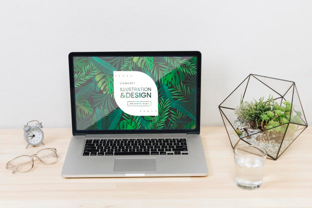 Desk Concept With Laptop And Water Glass Psd