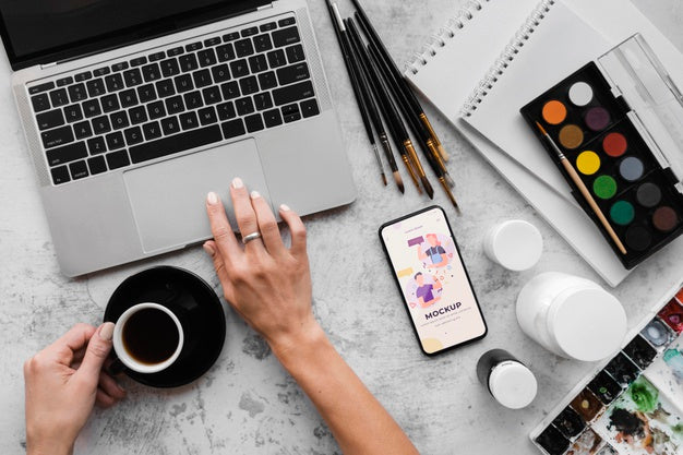 Desk Of Painting Artist With Laptop Psd