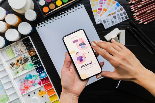 Desk Of Painting Artist With Mobile Psd