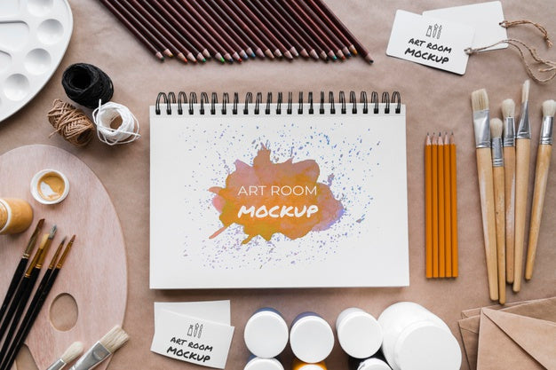 Desk Of Painting Artist With Notebook Psd