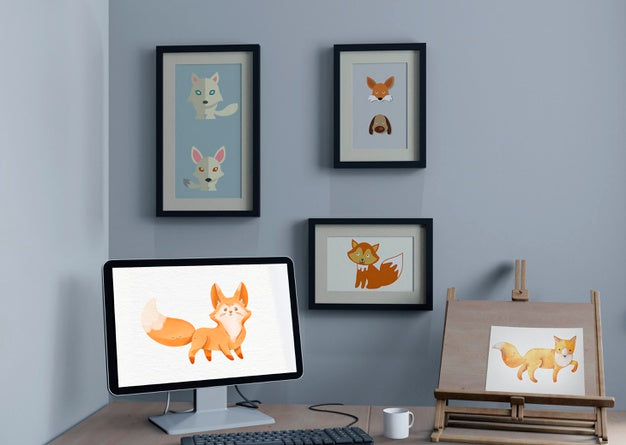 Desk With Monitor And Painting Support And Frames On Wall Psd