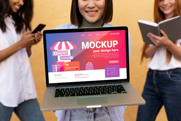 Different Beautiful Women Holding A Laptop Mock-Up Psd