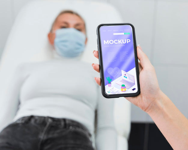 Doctor Holding Phone Mock-Up Near Patient Psd